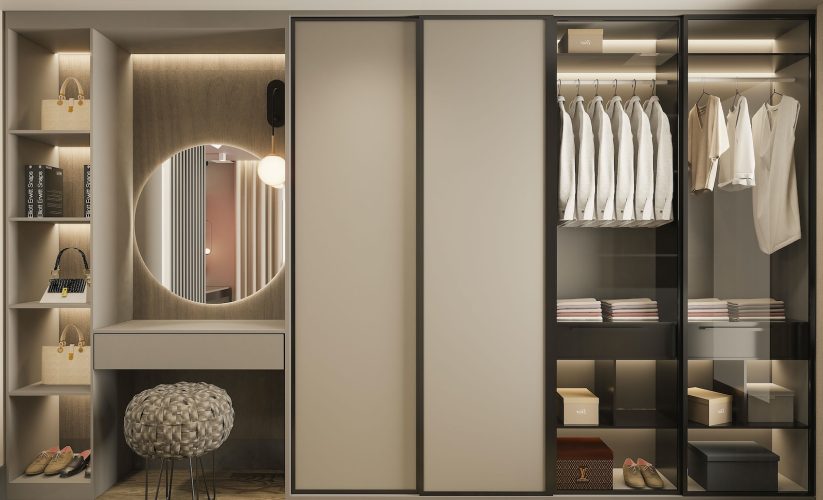 a walk in closet with a mirror and a stool